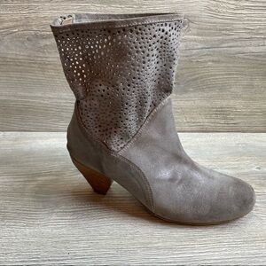 Woman’s grey perforated fine leather shirt ankle boot full heel zipper